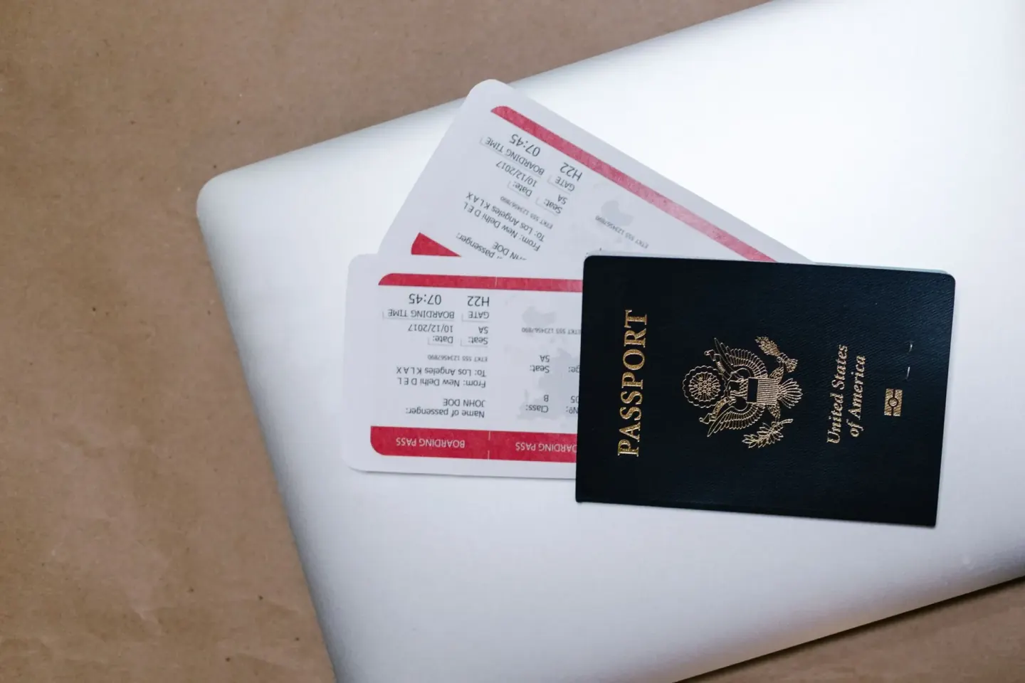 Passport documents and airline tickets laid on desk for visa consultancy